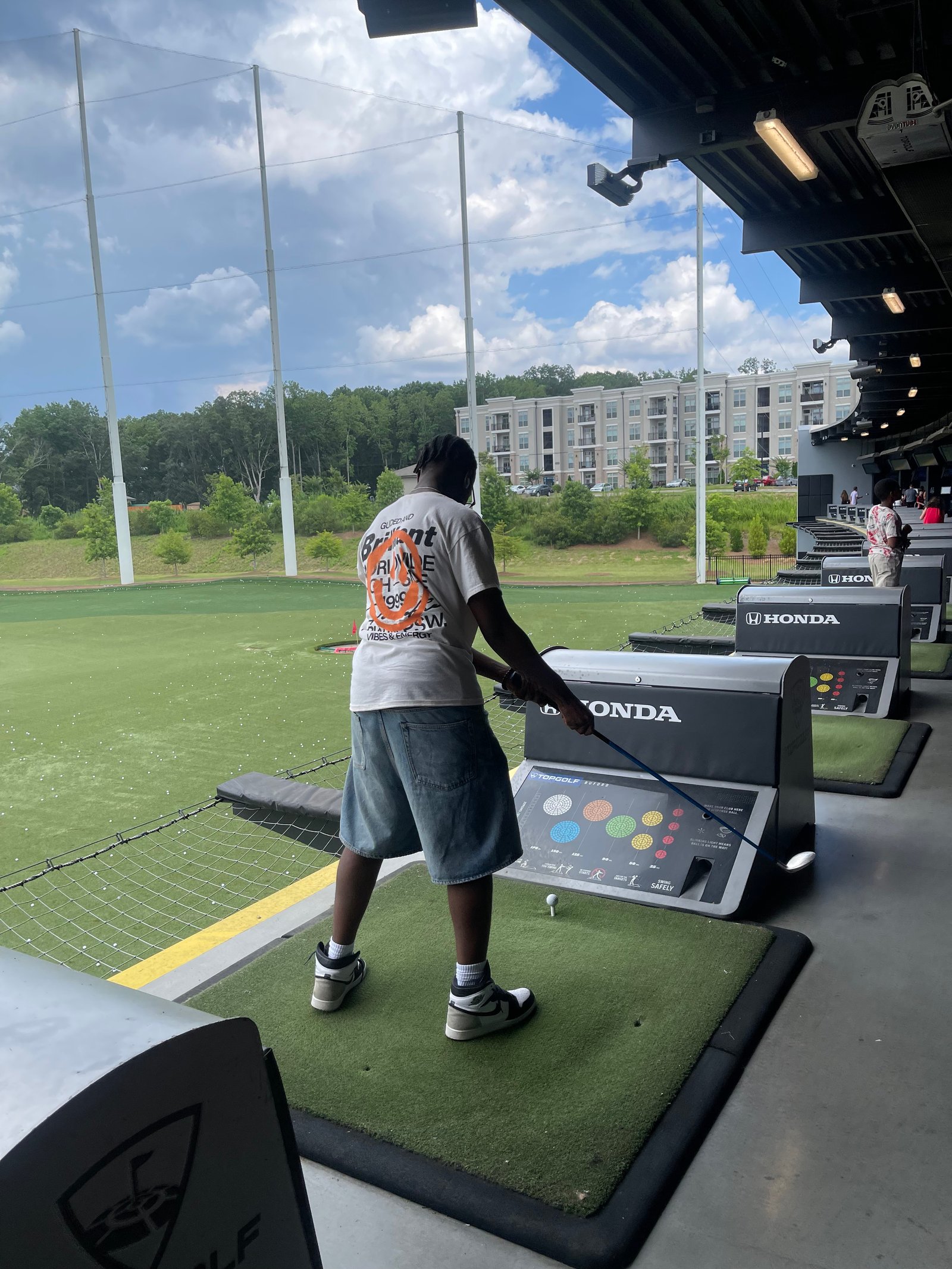 Nathan at a driving range